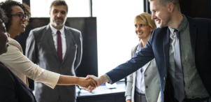 partners shaking hands in a business environemnt