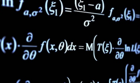 photograph of scientific equations on a blackboard